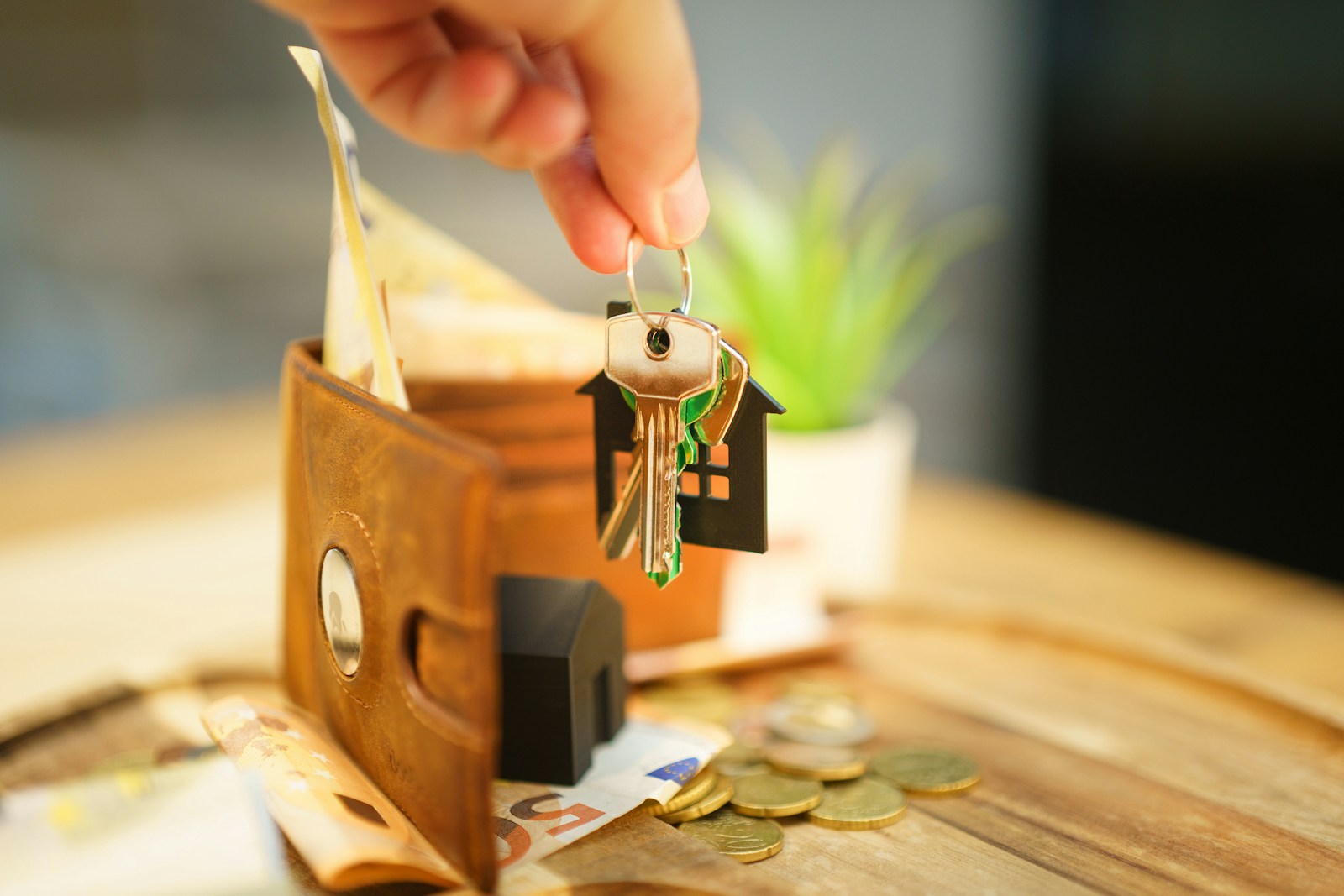House keys and wallet representing security deposit and move-in costs