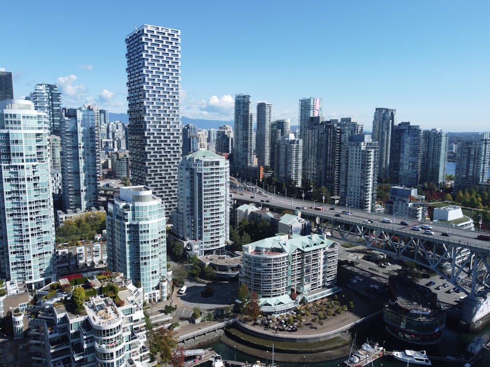 Aerial view of Vancouver rental apartment buildings and condos with downtown skyline
