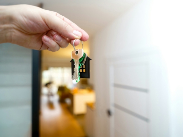 Keys held at the entrance to a residential rental property