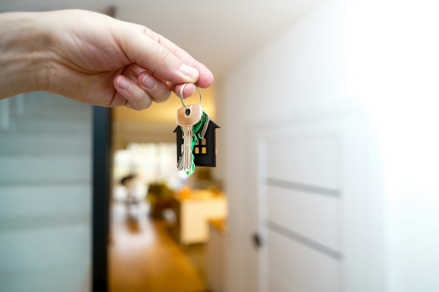 Keys held at the entrance to a residential rental property